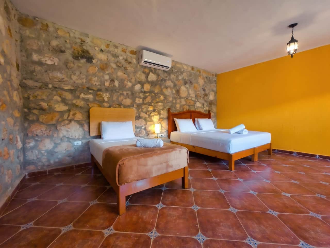 Room with a single bed and a double bed.