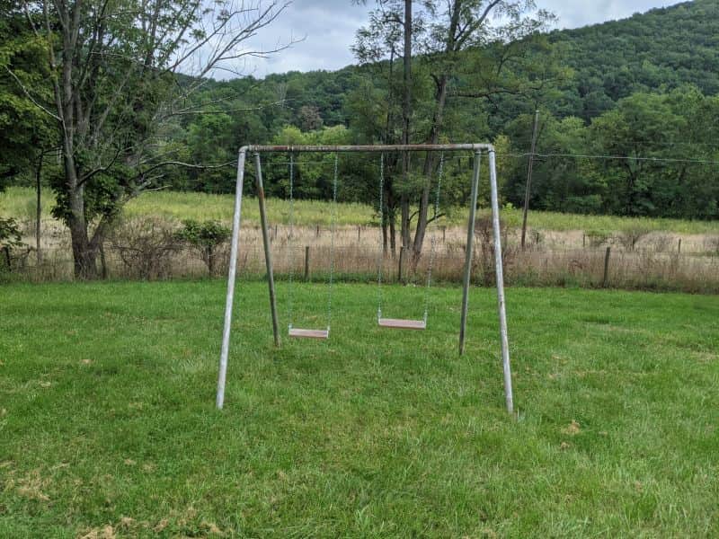 The swing set in the front yard