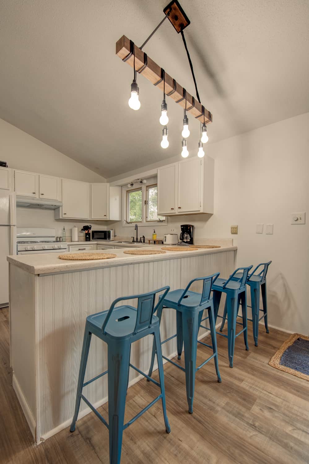Kitchen area with bar stools