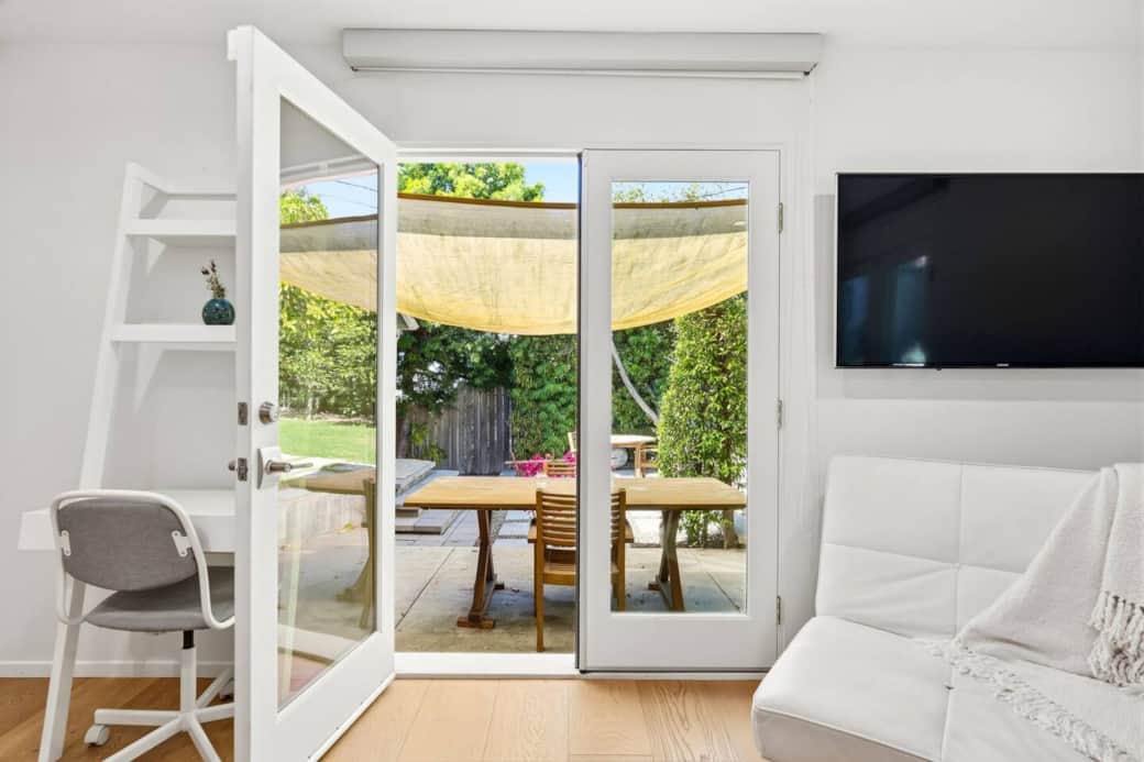Glass doors open directly to the patio for easy outdoor dining access. Glass doors open directly to the patio for easy outdoor dining access.