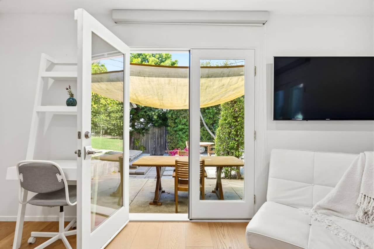Glass doors open directly to the patio for easy outdoor dining access.