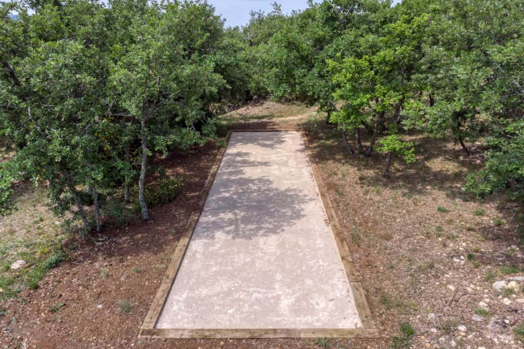 Boulodrome shaded by trees