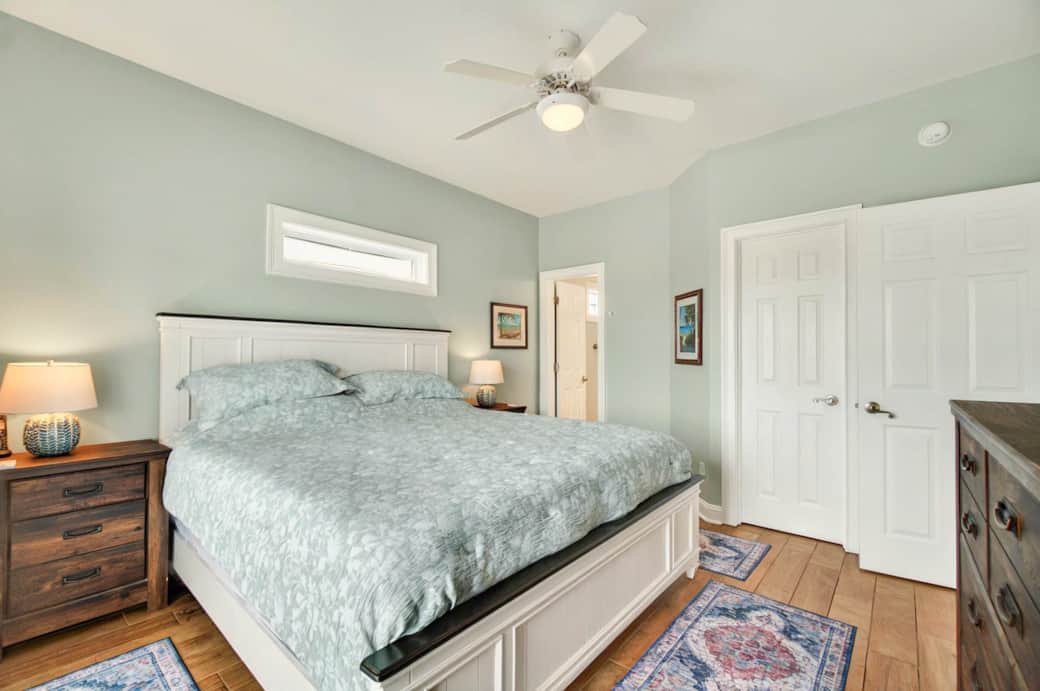Primary bedroom with king bed and en suite bathroom