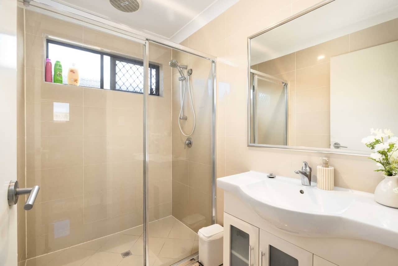 Bathroom: Stylish bathroom with walk-in shower, vanity, and clean finishes 