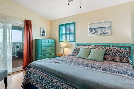 Primary bedroom with gel-top king mattress, and full bathroom.
