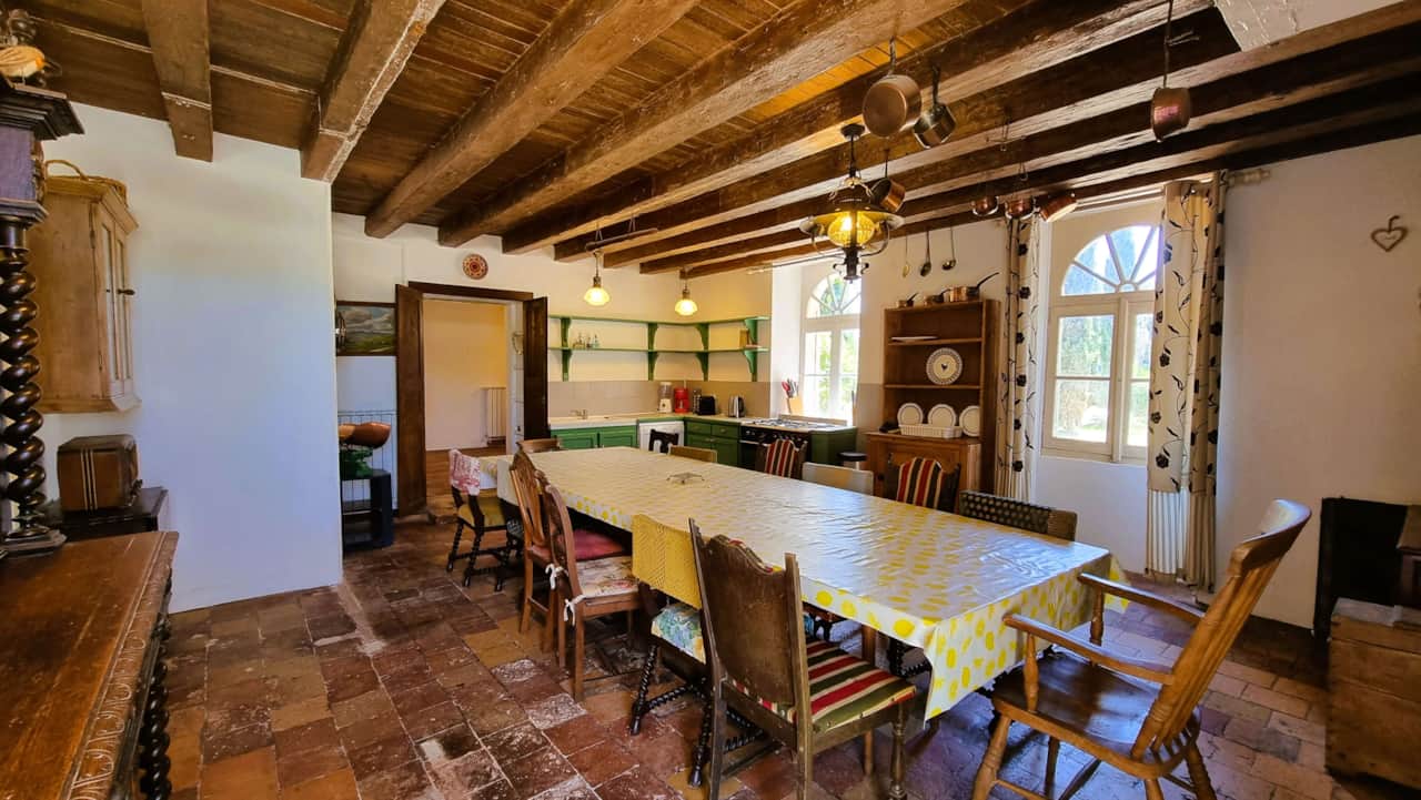 Large dining room with exposed beams
