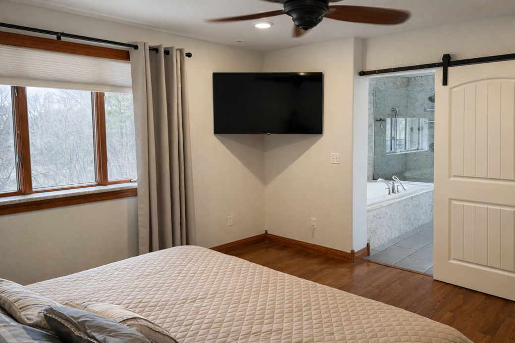 Primary suite with ensuite bath and Roku TV.