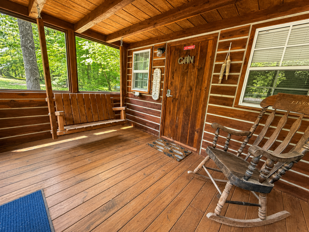 Screened front porch with swing