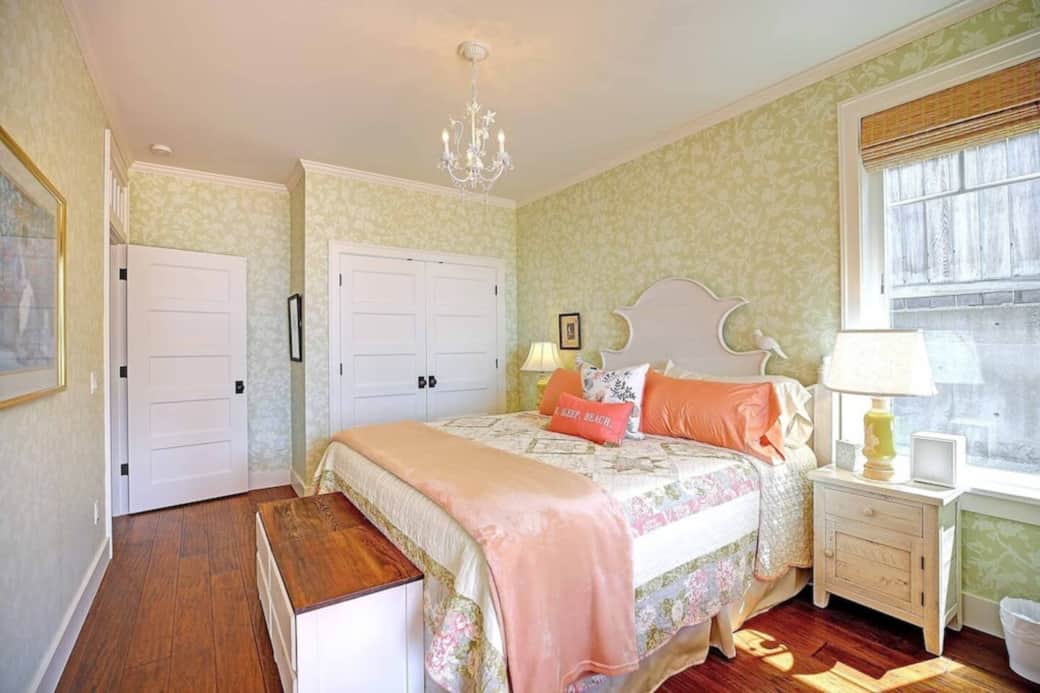 The downstairs bedroom has a queen bed and a closet with a dresser.