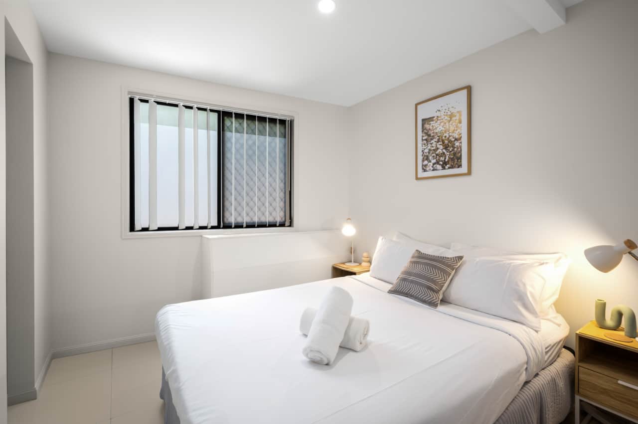 Bedroom 1: Peaceful bedroom with cozy design and ample storage