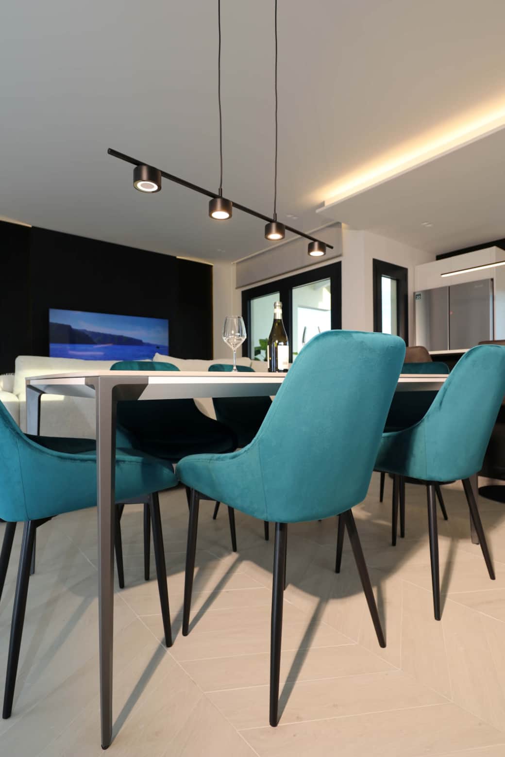 Dining table modern lighting turquoise chairs Holiday Via de Filippi 14A Olbia Rental 12 com