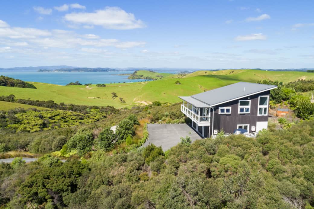 Wharau Lodge holiday home nestled in native bush with views over the Bay of Islands near Kerikeri.