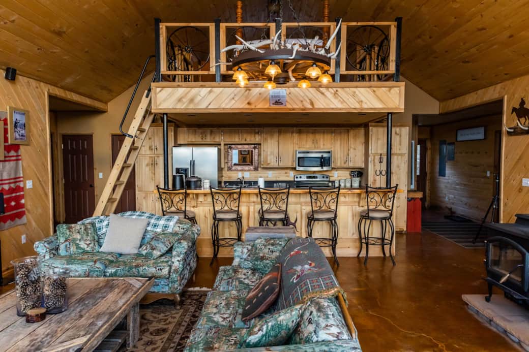 Open concept kitchen with five barstools, providing additional seating. Open concept kitchen with five barstools, providing additional seating.