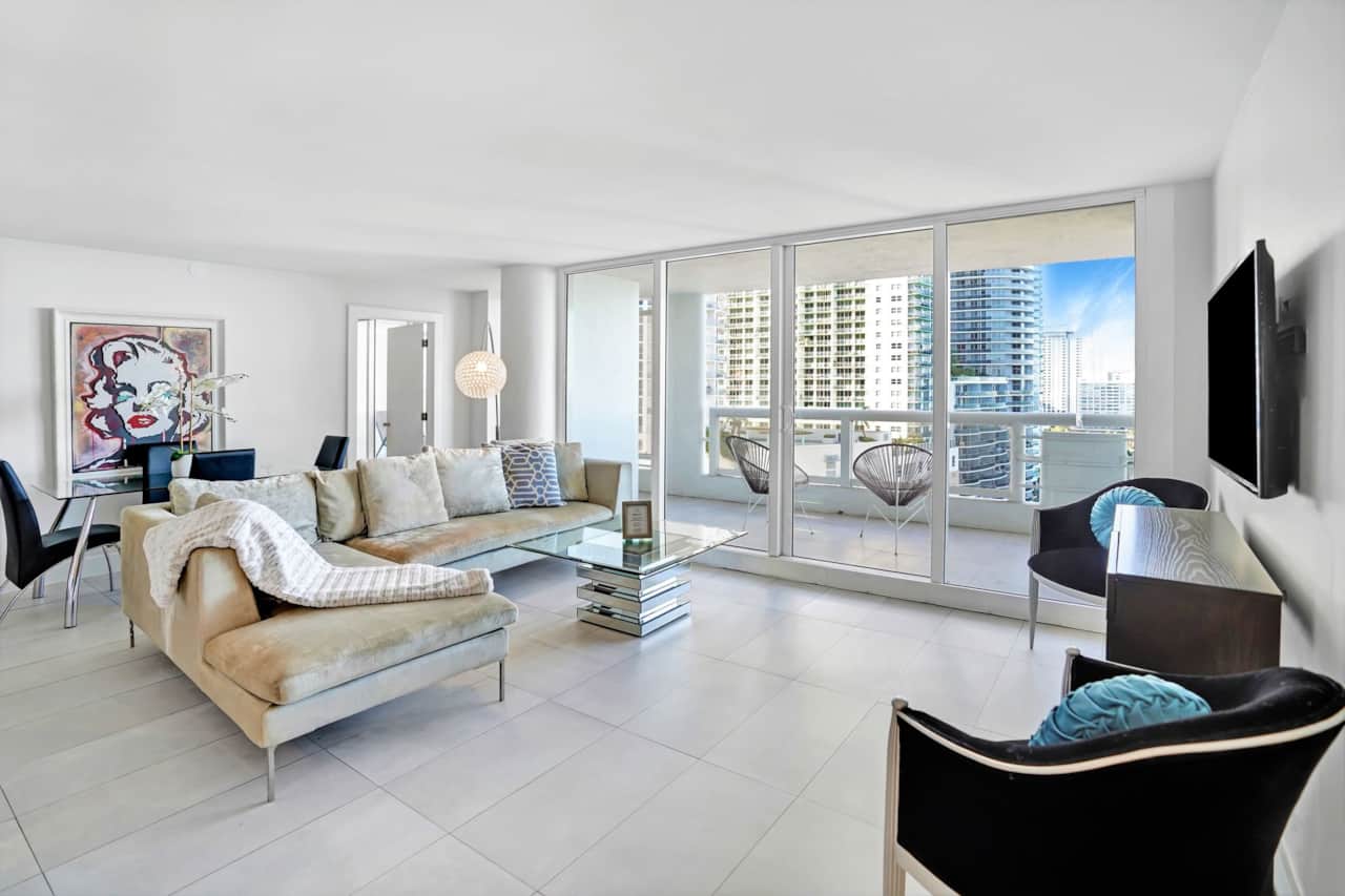 Living room, dining area, Roku Tv, balcony access