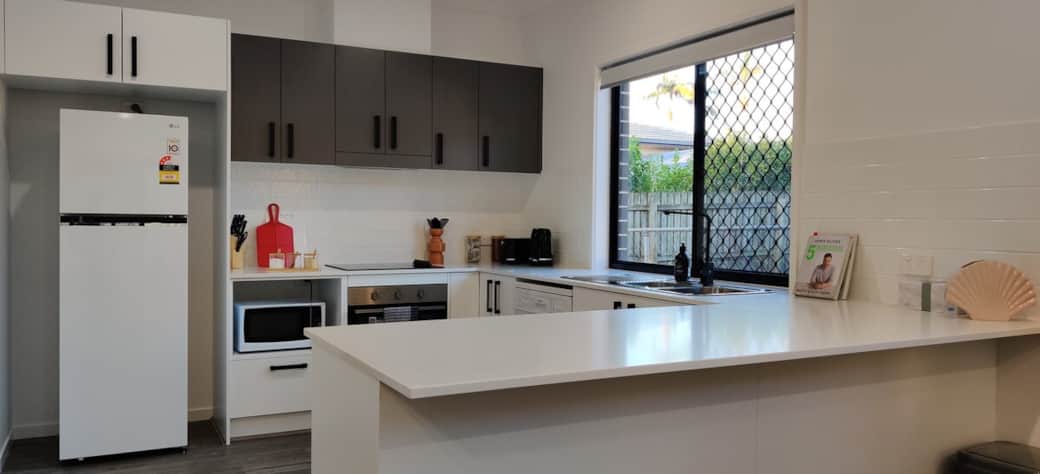 Another full view of the kitchen which has everything you need to make your stay even more fun!