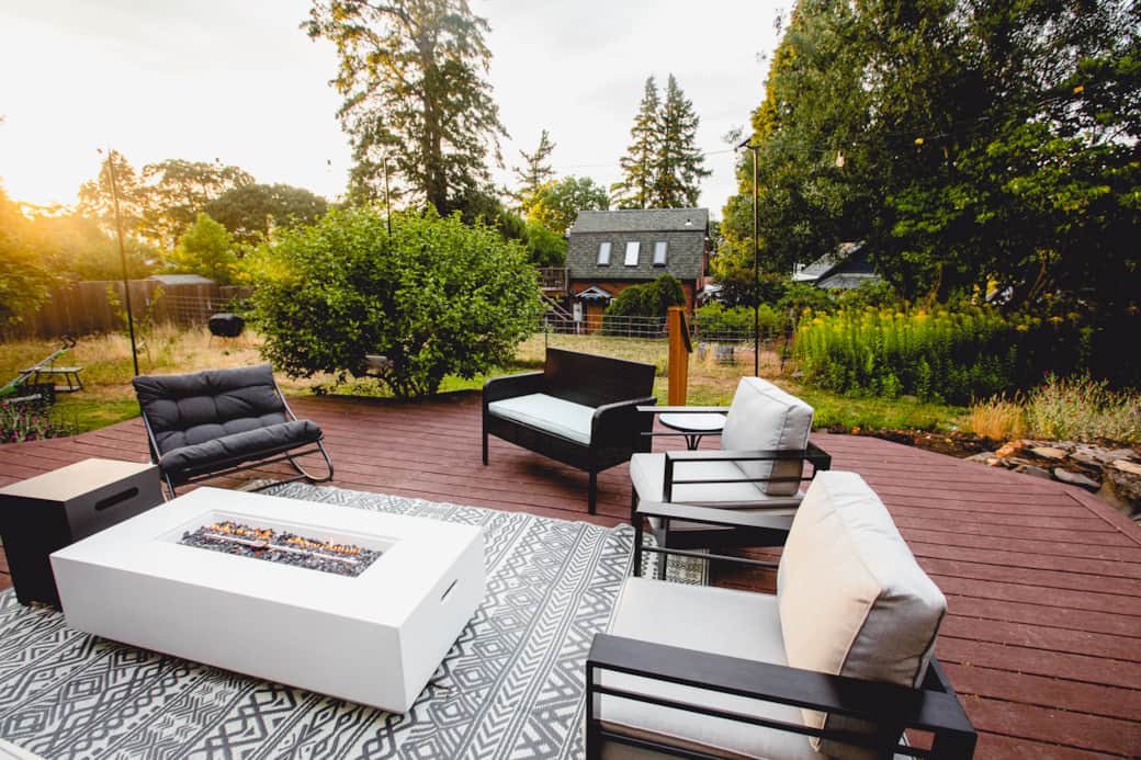Back Porch with string lights, comfortable seating and fire pit