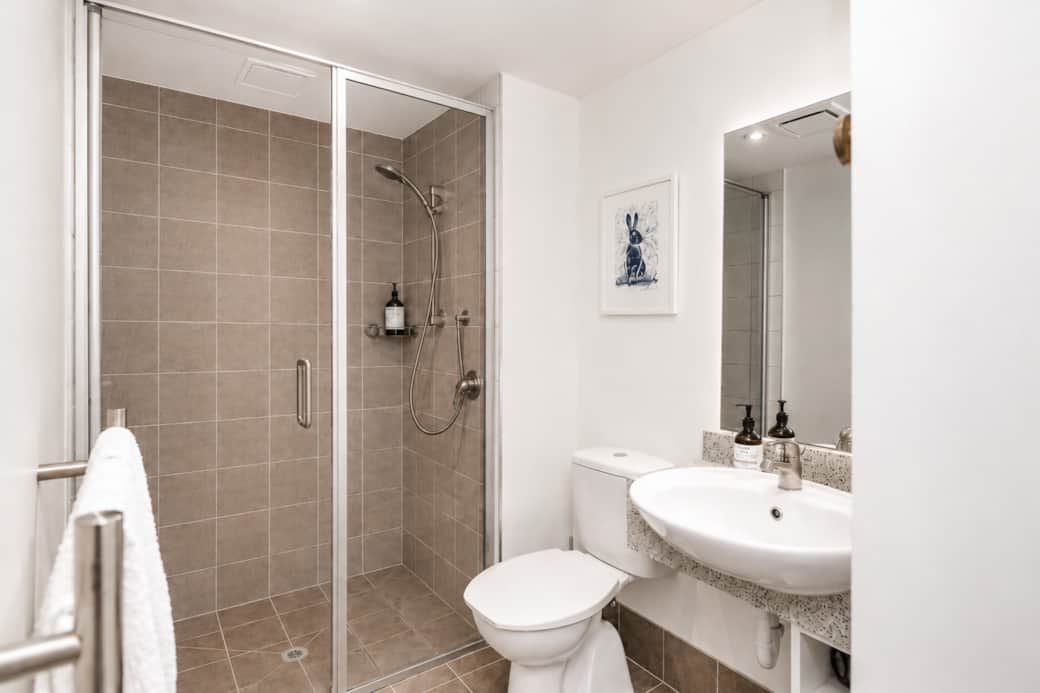 Tiled bathroom and shower Tiled bathroom and shower