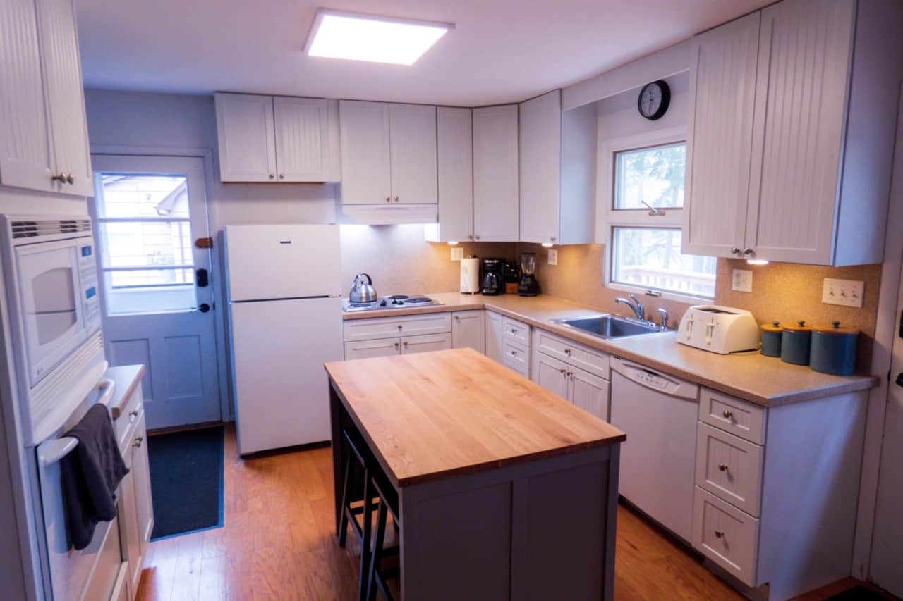 Kitchen with a central island. Bar seating for two at the island.