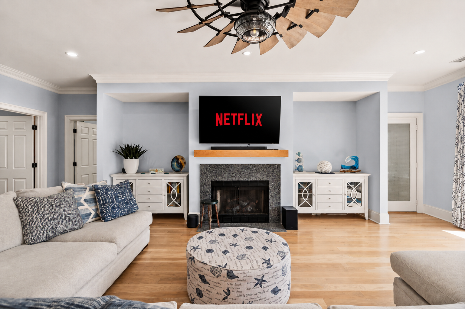 Curl up by the fireplace and queue up a show on the mounted TV.