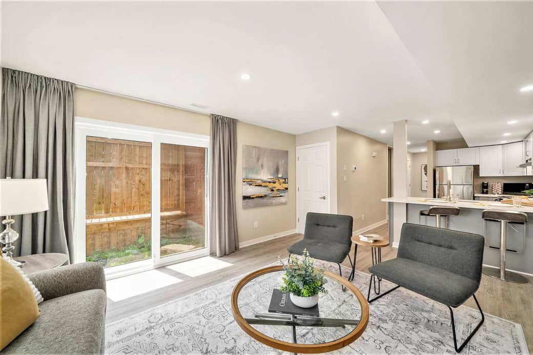 Brand new patio doors lead you outside to your private wood deck and fenced backyard.  Brand new patio doors lead you outside to your private wood deck and fenced backyard.