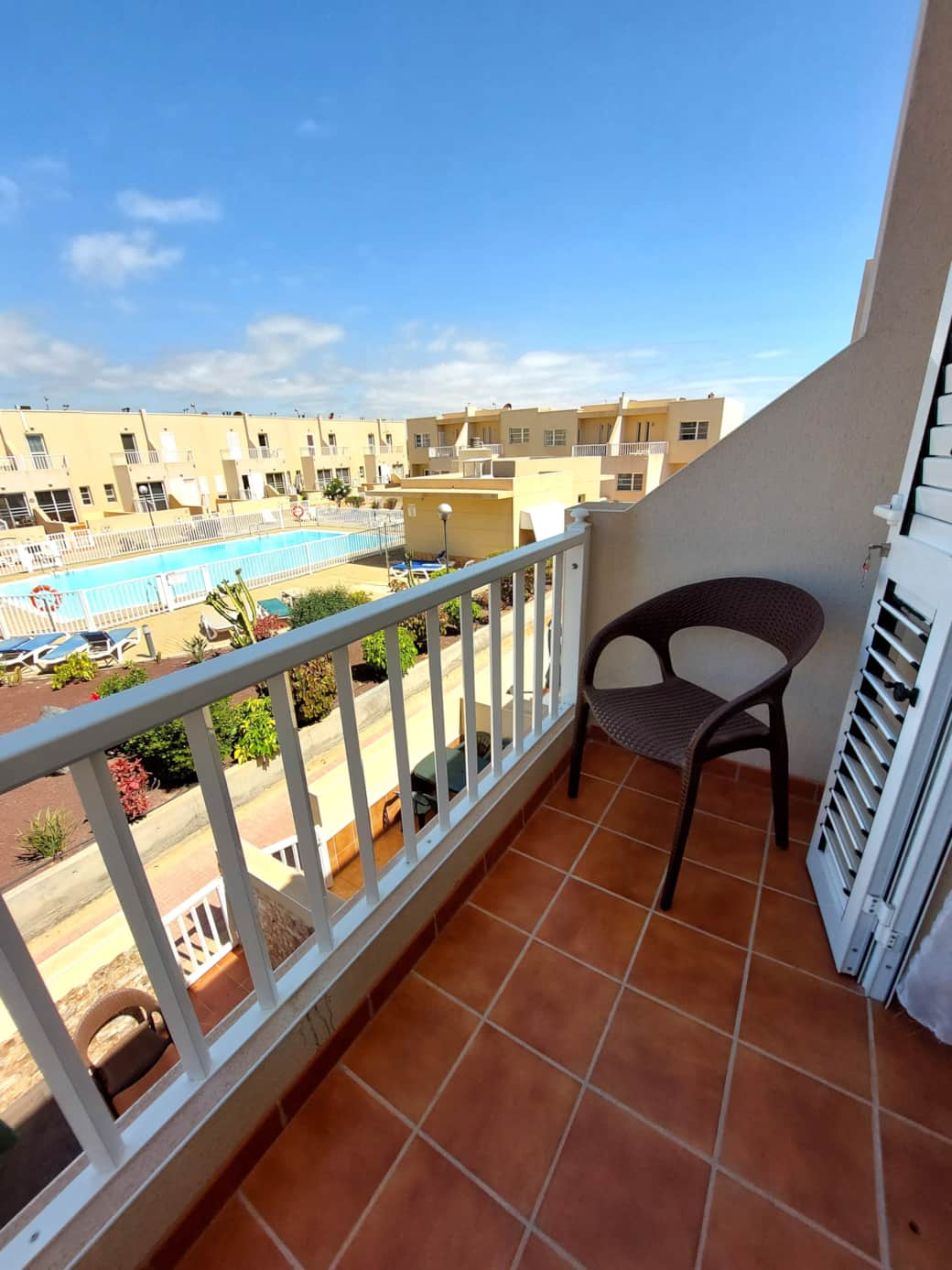 Tranquil balcony area at Litha House, providing serene views and a peaceful spot to relax.