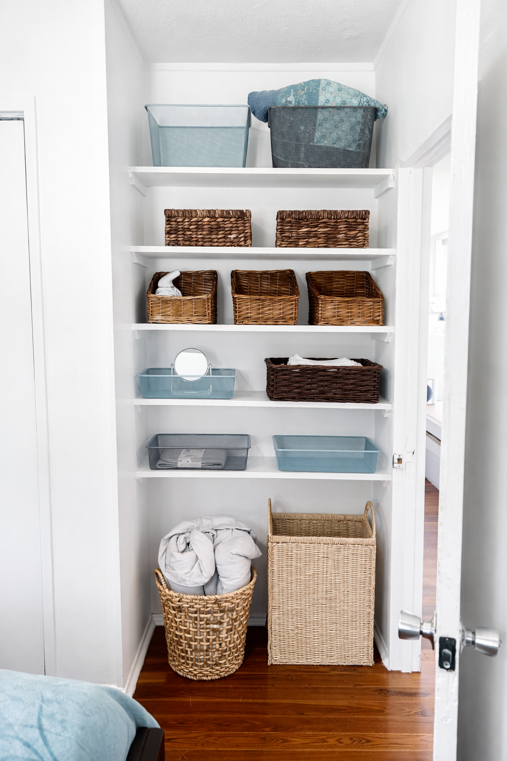 Thoughtful shelf space with baskets for easy organization and a clean, relaxed feel.