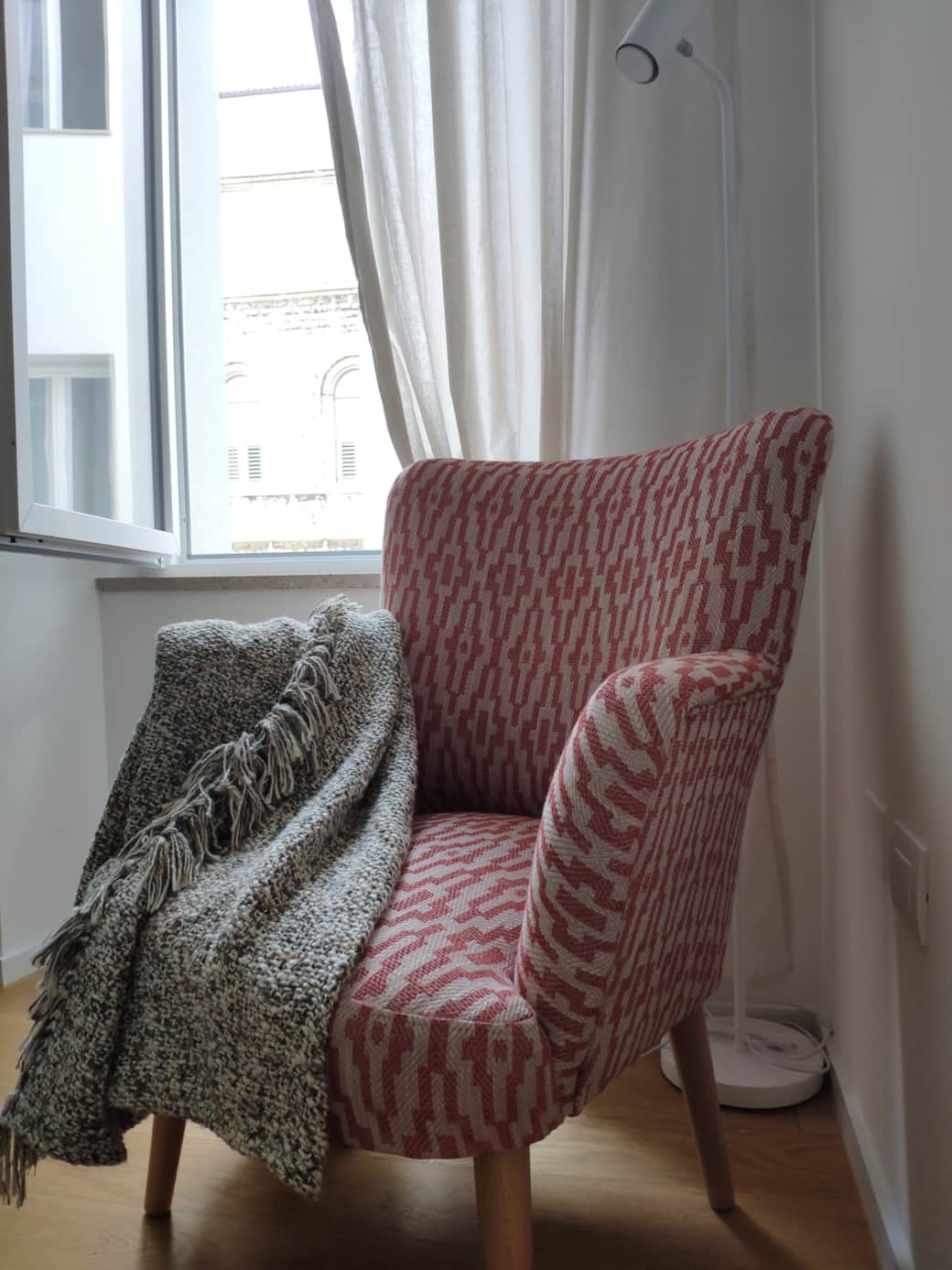 Armchair and reading lamp in the bed room