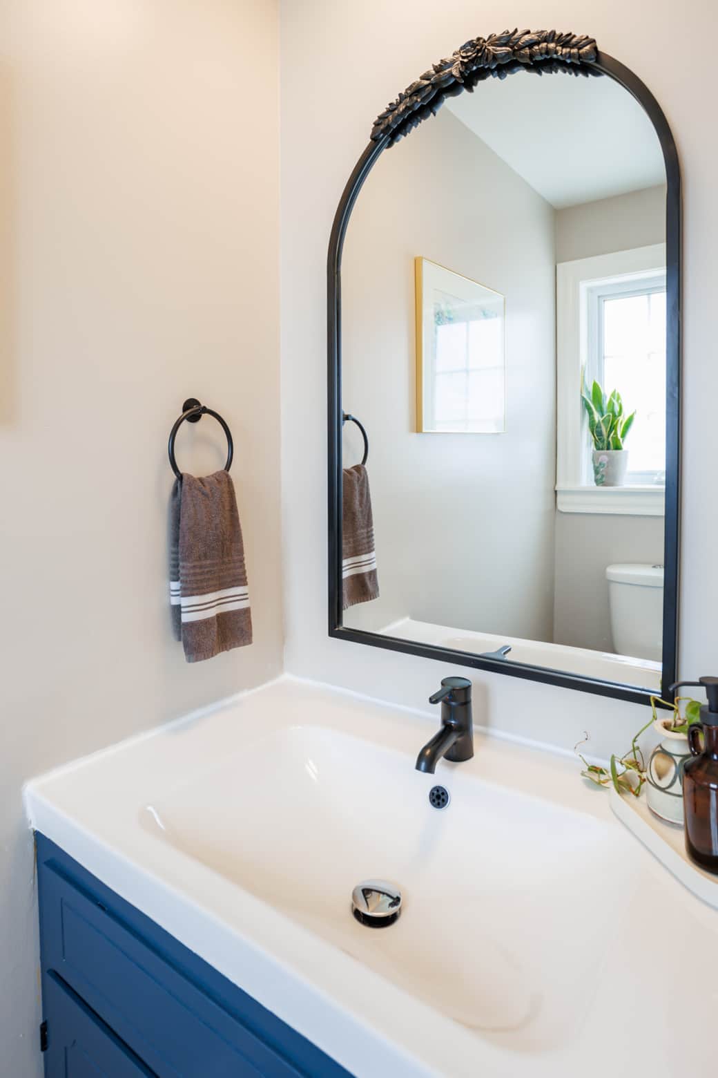 Stylish half bath with modern finishes and a clean, fresh feel.