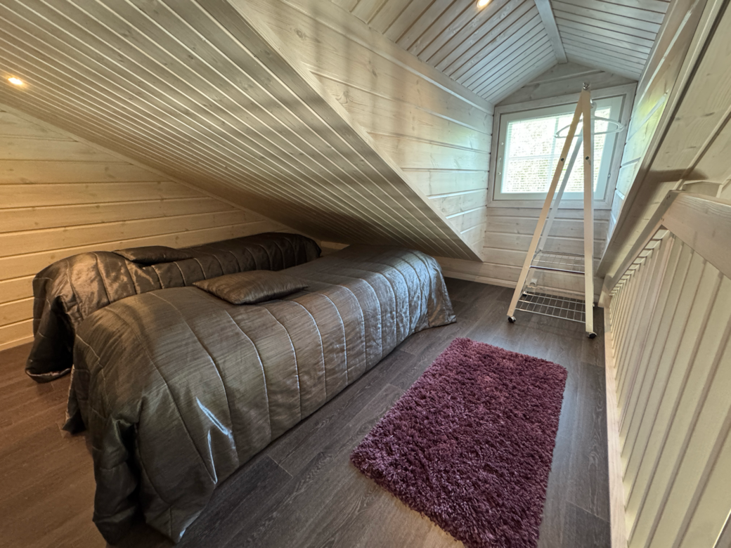 Upstairs: two separate beds and clothes hanging rail. Upstairs: two separate beds and clothes hanging rail.