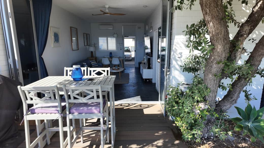 Imagine entertaining on the seamless indoor-outdoor deck area into the living space through the full wide bifold doors. The soft neutral tones create a calm coastal ambiance.