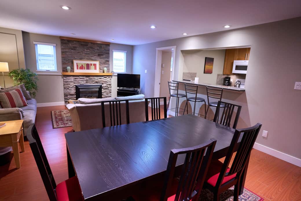 Bright, open concept dining/living room with hightop chairs at breakfast nook Bright, open concept dining/living room with hightop chairs at breakfast nook