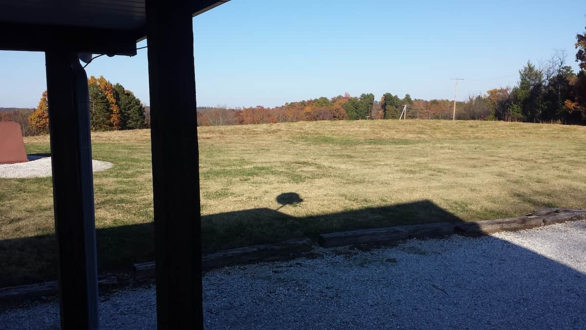 View to adjacent pasture from deck rolling into Ozark National Forest