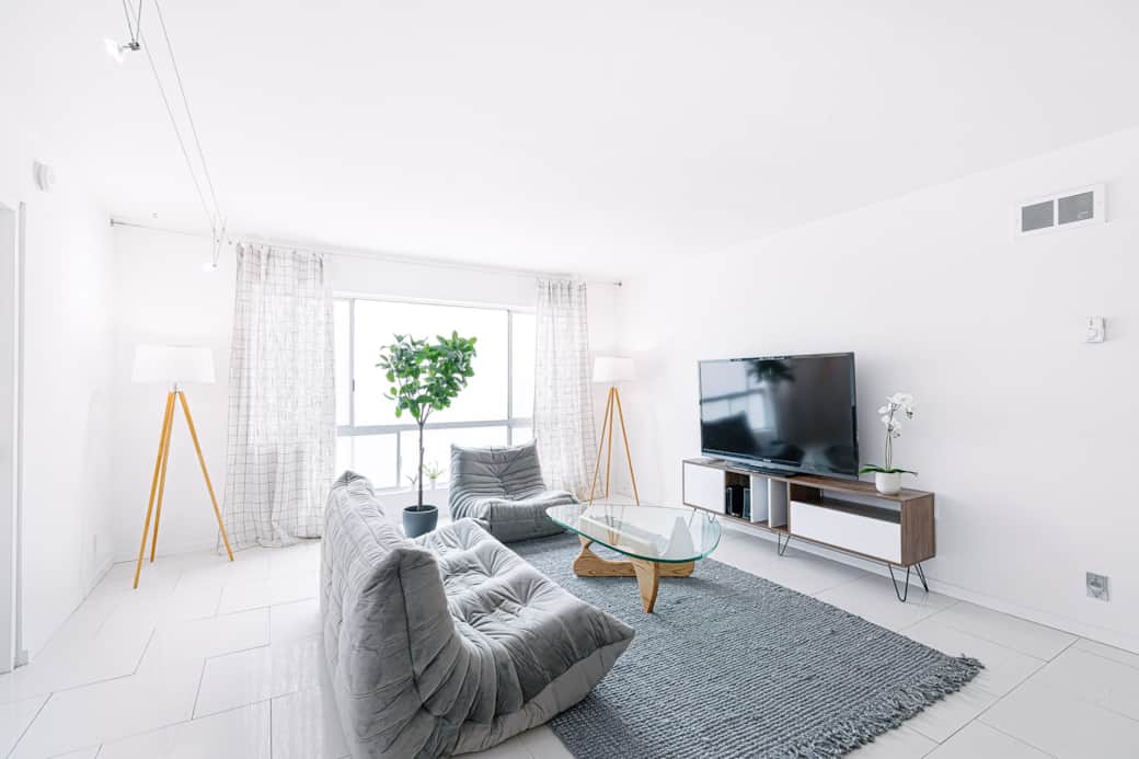 Unwind in style in our well-lit living room, featuring a generous TV for your viewing pleasure