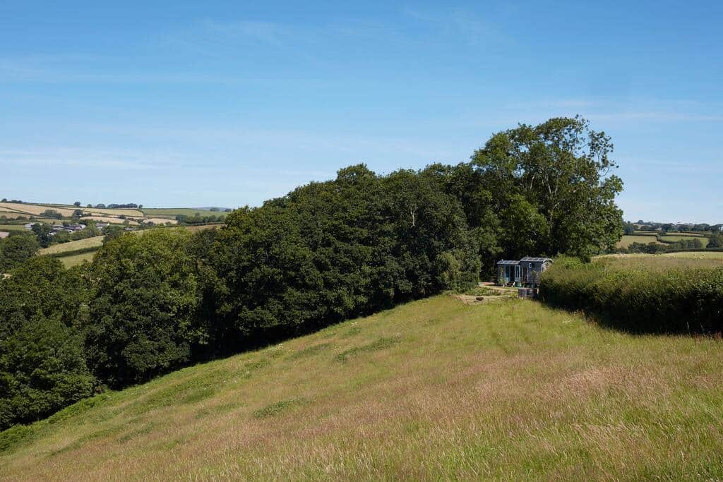 Hut from the other side of the field, with a beautiful vista.