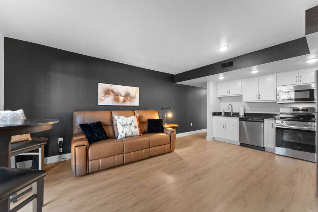 Modern, updated living area with kitchen.