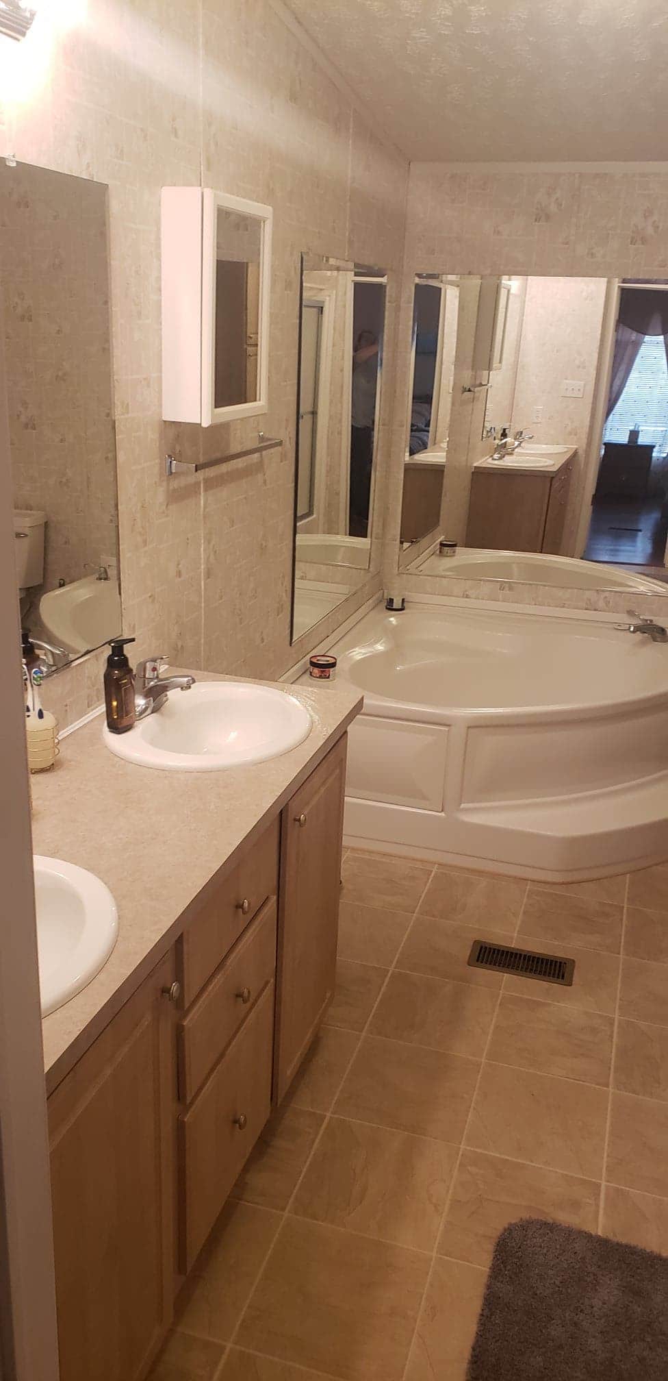 Master Bathroom with double vanity, shower and soaking tub