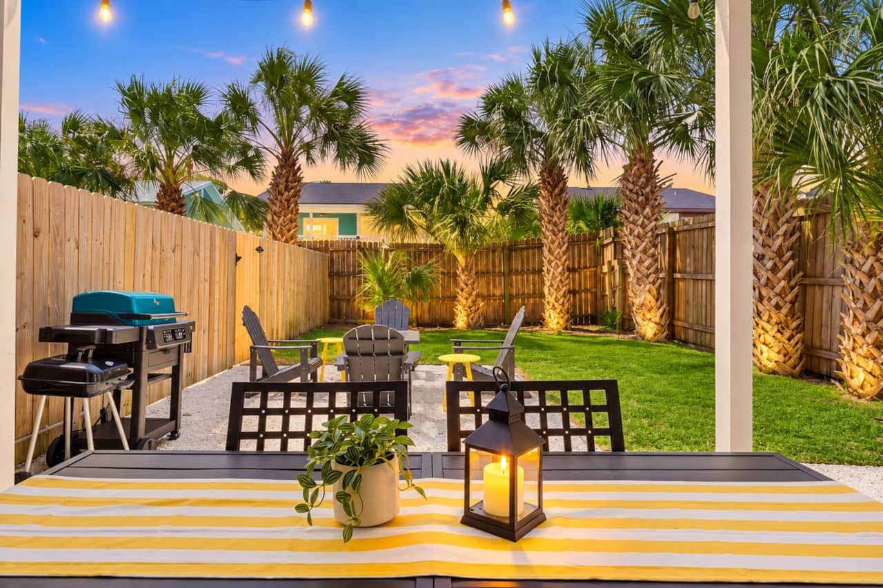 Your private, fully fenced backyard includes a fire pit, covered outdoor dining, electric and charcoal grills, cornhole, and giant four-in-a-row. Enjoy family games, BBQ dinners, and evenings beneath the palms. Pets are welcome, too