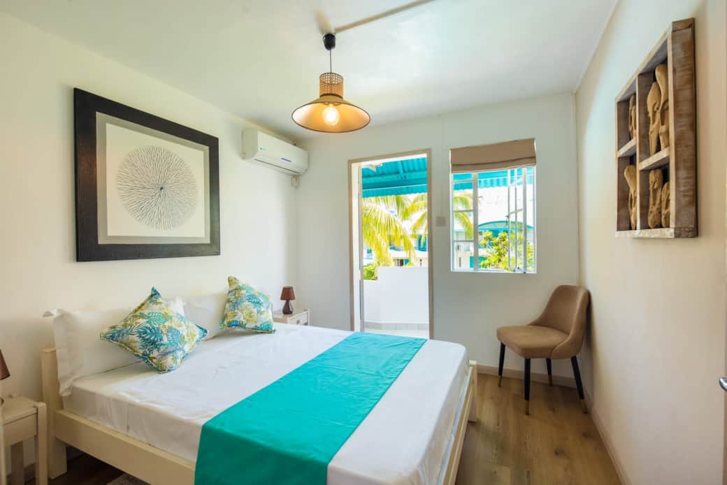 Bedroom 1 with balcony overlooking the garden Bedroom 1 with balcony overlooking the garden