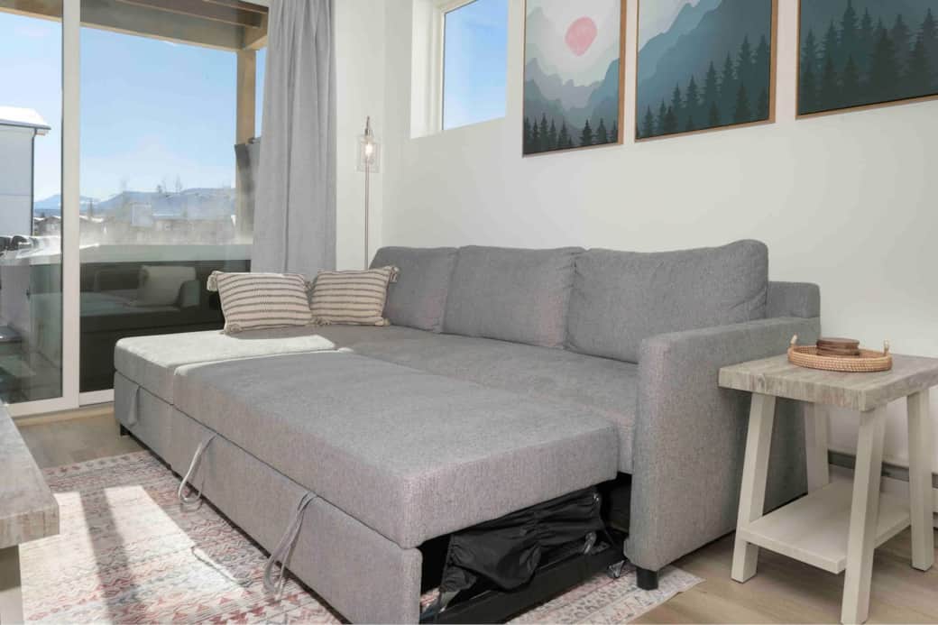 Couch doubles as a full size bed. Mattress pad, sheets, blankets and a pillow are located in the storage compartment under the chaise.