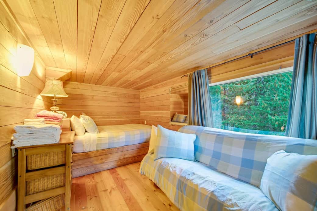 Main chalet suite featuring a queen bed and futon. Main chalet suite featuring a queen bed and futon.