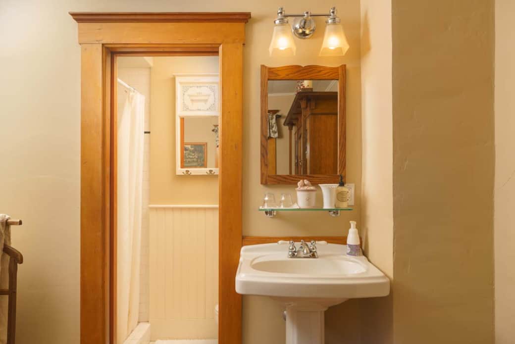 Spacious shower with warm earth tones in the private bathroom. Spacious shower with warm earth tones in the private bathroom.