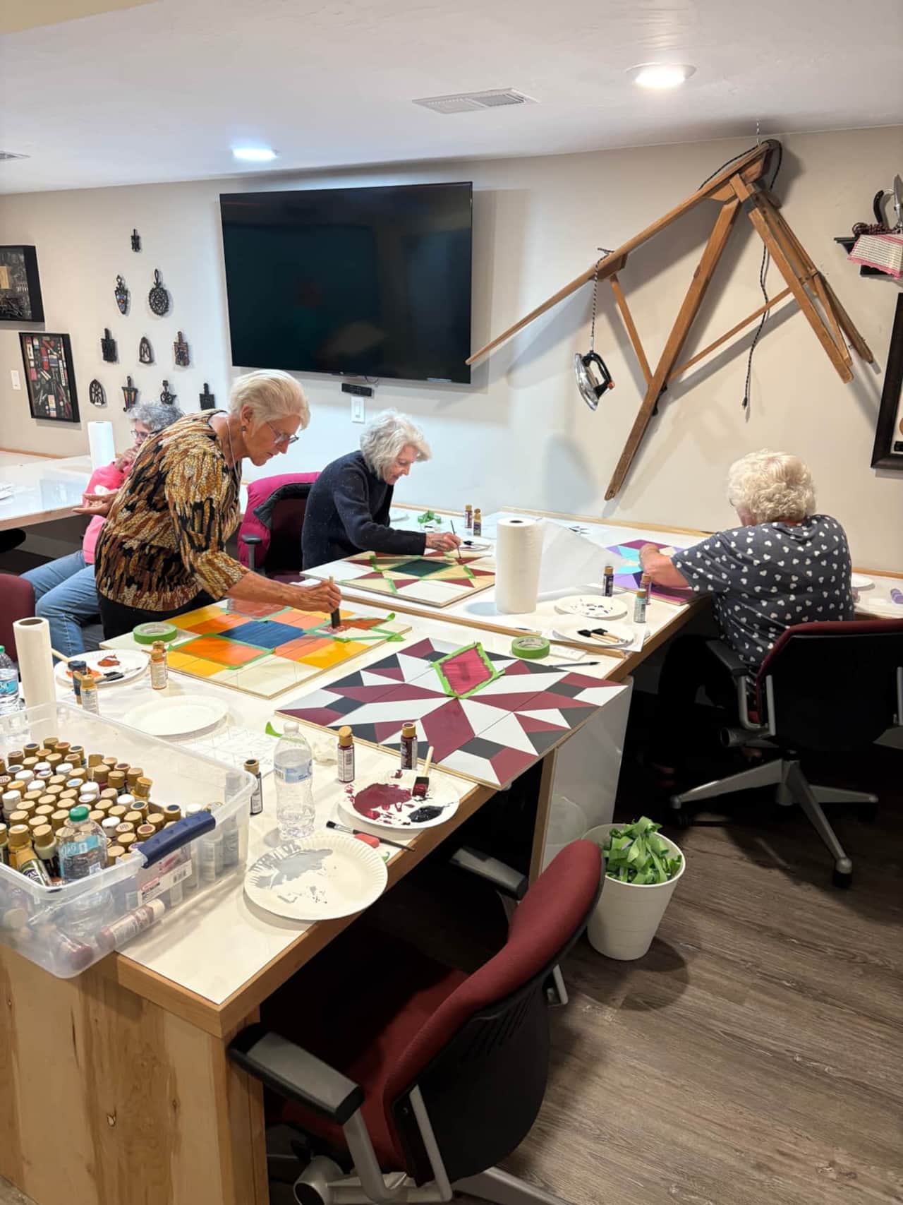cedar-city-quilt-retreat-ladies-painting-barn-quilt-blocks.jpg
