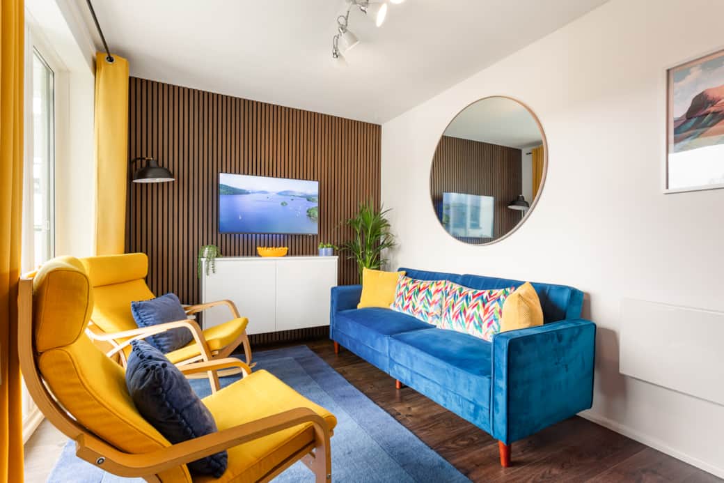 Lounge with seating for 4 and media wall with Smart TV Lounge with seating for 4 and media wall with Smart TV