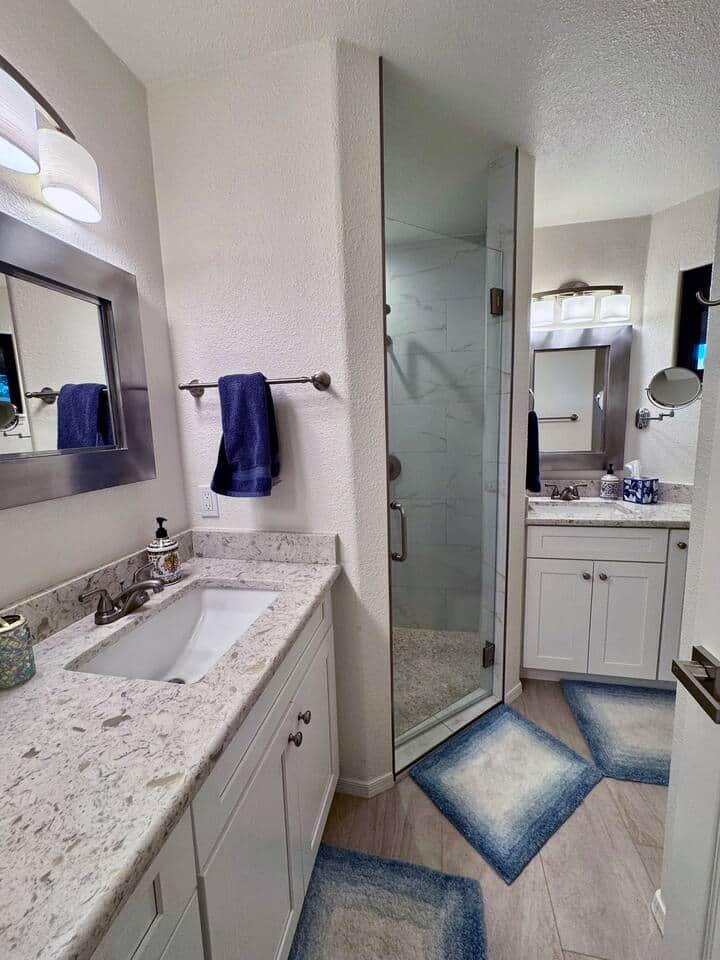 Double sinks and a walk in shower offer privacy and all the amenities you'll need. Double sinks and a walk in shower offer privacy and all the amenities you'll need.