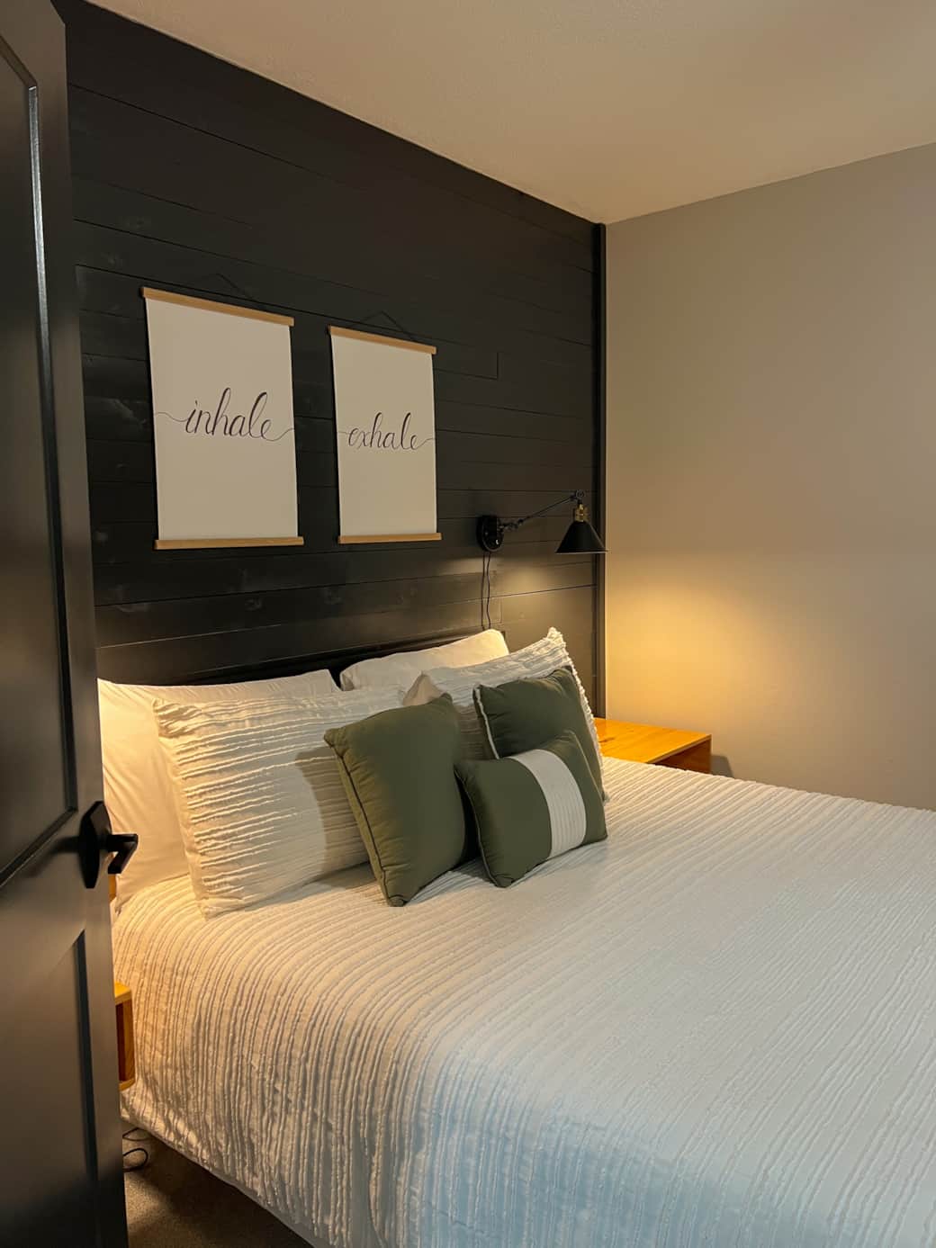 lower level queen bedroom with office area and balcony access