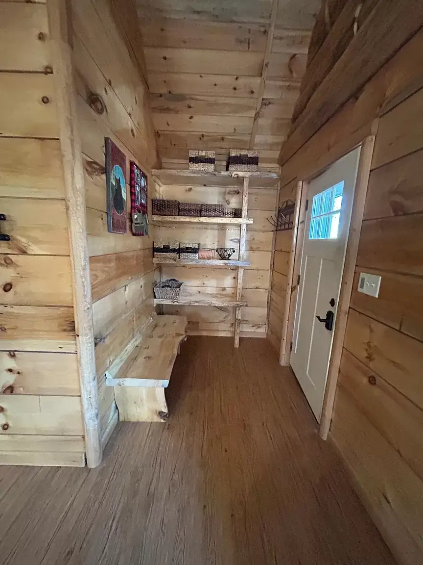 Entrance with bench and drop zone for your gear as you come off the lake, UTV or snowmobile trails