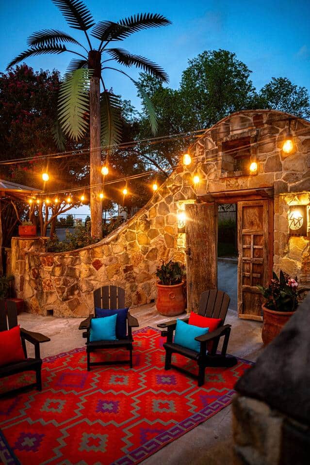 Large patio with seating by the fire, large dinning table that seats 12, out door grill, bar seating and stereo  system. 