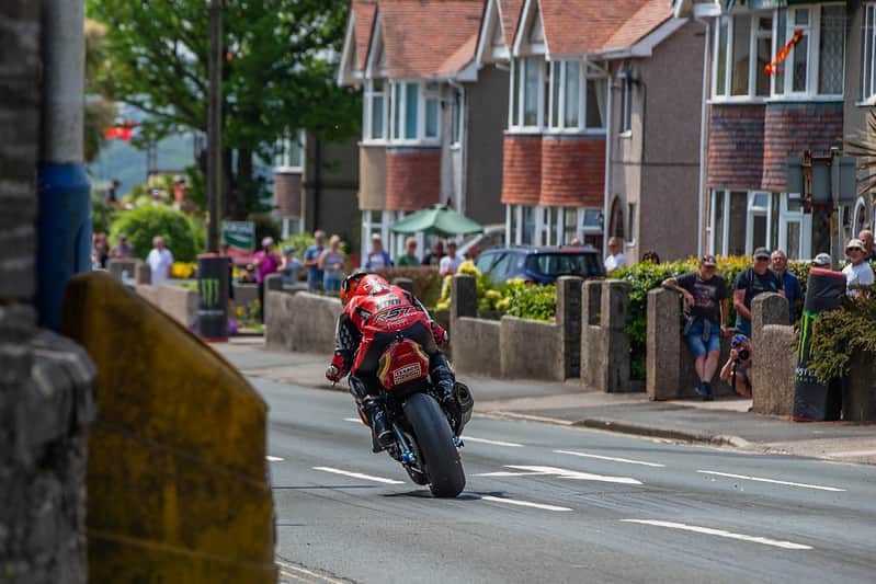 Motorcycle racing down Bray Hill during the Isle of Man TT (Credit Visit Isle of Man)
