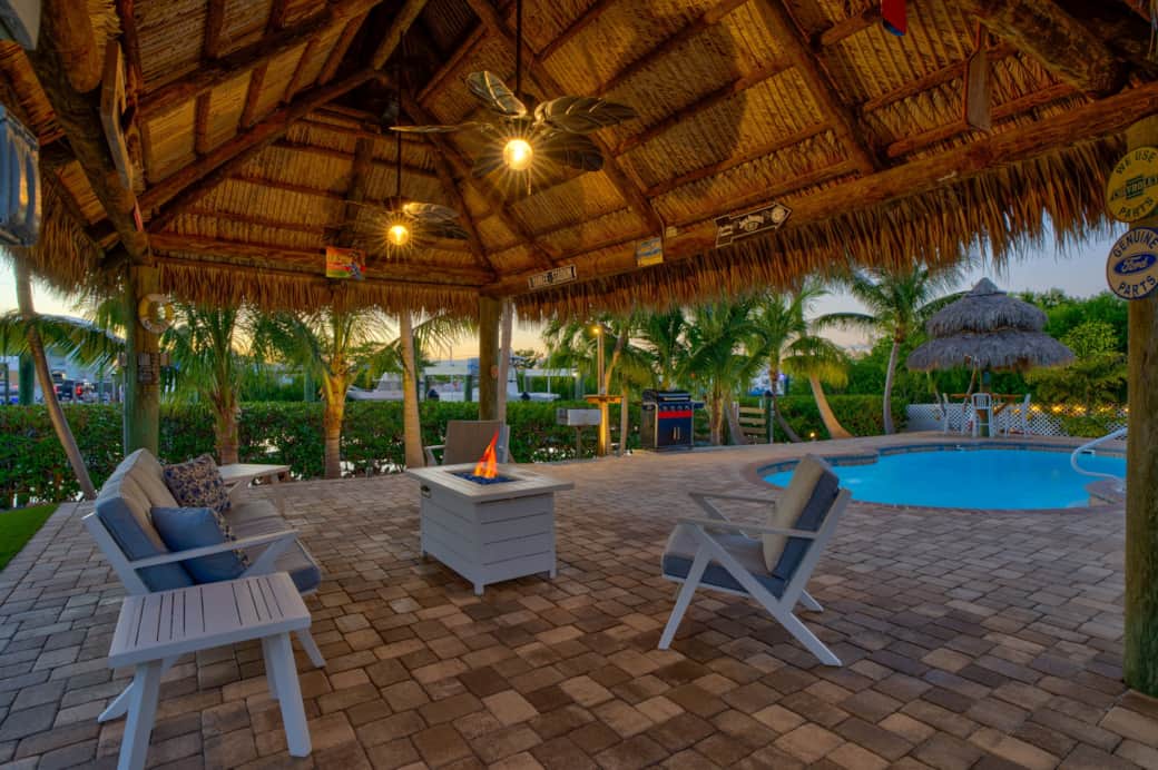 Tiki hut 1 with fire pit burning sunset