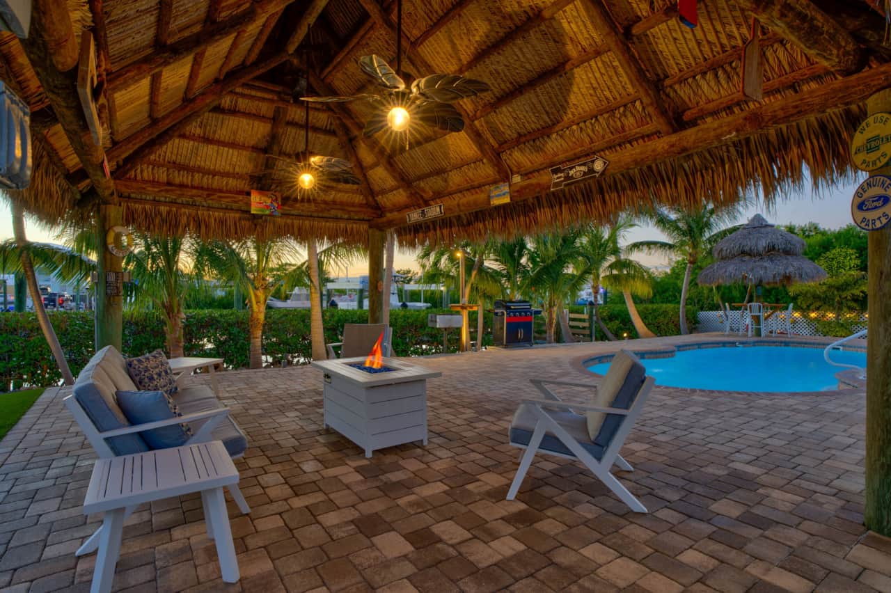 Tiki hut 1 with fire pit burning sunset
